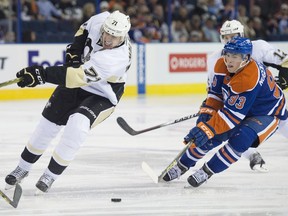 EDMONTON, AB. NOVEMBER 6,  2015 - Ryan Nugent-Hopkins of the Edmonton Oilers, moves in on a puck missed by Evgeni Malkin of the Pittsburgh Penguins at Rexall Place in Edmonton. Shaughn Butts / Edmonton Journal ******EDMONTON SUN OUT**********