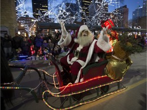 Santa sings to the crowd during Santa's Parade of Lights on Nov. 21, 2015, in Edmonton.