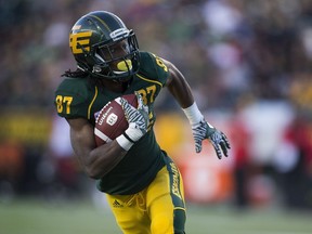 Edmonton Eskimos Derel Walker (87) runs the ball against the Calgary Stampeders on Sept. 10, 2016, in Edmonton.