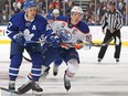 Toronto Maple Leafs forward Leo Komarov, left, and Edmonton Oilers centre Connor McDavid in NHL action at Toronto's Air Canada Centre on Nov. 1, 2016.