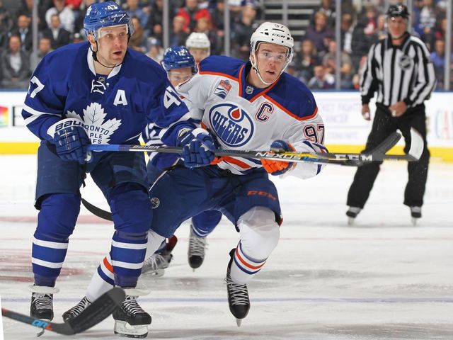 TORONTO, ON - NOVEMBER 1: Connor McDavid #97 of the Edmonton Oilers skates against Leo Komarov #47 of the Toronto Maple Leafs during an NHL game at the Air Canada Centre on November 1, 2016 in Toronto, Ontario, Canada.