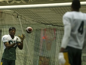 Edmonton's Derel Walker (87) and Adarius Bowman (4) throw around a ball during an Edmonton Eskimos practice in the Field House at Commonwealth Community Recreation Centre in Edmonton, Alberta on Wednesday, November 2, 2016.