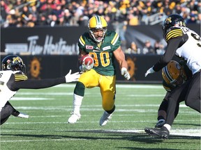 Edmonton Eskimos running back John White (30) in mid-run towards a touchdown during the first-half of CFL eastern semi-final football action, in Hamilton, Ont., on Sunday, November 13, 2016.