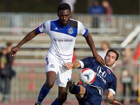 Nov 5, 2016;  Indianapolis, IN USA;  NASL Playoffs FC Edmonton at Indy Eleven  -  match held at IUPUI's Michael A. Carroll Stadium. Mandatory Credit: Matt Schlotzhauer --- Begin Additional Info --- FC Edmonton striker Tomi Ameobi avoids a tackle from Indy Eleven midfielder Dylan Mares in the North American Soccer League semifinal at Carroll Stadium in Indianapolis, Indiana on Saturday, Nov. 5, 2016.