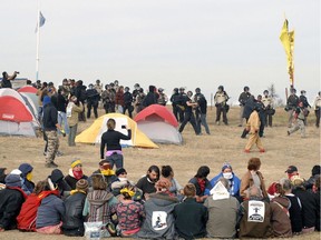 Dakota Access Pipeline protesters sit in a prayer circle on Oct. 27, 2016 on Highway 1806 in Morton County, N.D.