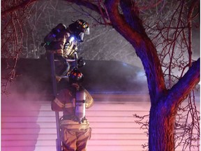 Fire crews respond to a house fire at 116 Avenue and 127 Street in central Edmonton on Friday, Nov. 18, 2016.