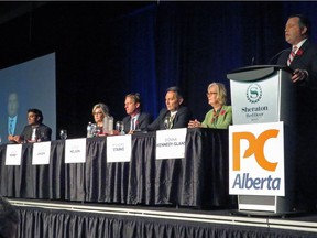 Former Conservative MP Jason Kenney speaks to 1,100 members in the first Alberta Progressive Conservative party leadership forum while the other five leadership candidates (left to right) Stephen Khan, Sandra Jansen, Byron Nelson, Richard Starke and Donna Kennedy Glans listen in Red Deer, Alta. Saturday, November 5, 2016. On Tuesday, November 8, both Jansen and Kennedy-Glans, the only women in the race, withdrew.