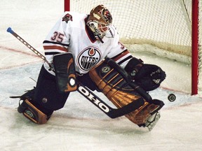 Edmonton Oilers goaltender Tommy Salo makes a save in the first period against the Toronto Maple Leafs on Oct. 19, 2000.