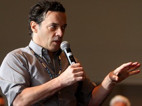 Giller Prize winning novelist Joseph Boyden speaks at the Indigenous Innovation Summit at the Shaw Centre in Edmonton, Nov. 9, 2016.