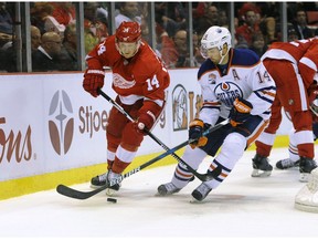 Detroit Red Wings right wing Gustav Nyquist (14) of Sweden skates against Edmonton Oilers right wing Jordan Eberle (14) during the third period of an NHL hockey game in Detroit, Sunday, Nov. 6, 2016. The Oilers defeated the Red Wings 2-1.