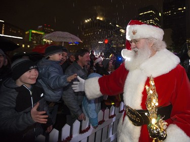 Santa Claus arrives at the Holiday Light Up festivities in Churchill Square, in Edmonton on Saturday Nov. 12, 2016.