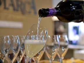 A person pours a glass of Prosecco on April 10, 2016 during the 50th edition of the Vinitaly wine exhibition in Verona.