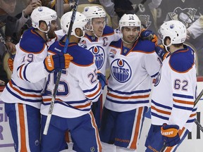 Edmonton Oilers' Jordan Eberle (14) celebrates his goal with teammates during the first period of an NHL hockey game against the Pittsburgh Penguins in Pittsburgh, Tuesday, Nov. 8, 2016. Eberle had two goals and an assist as the Penguins won 4-3.