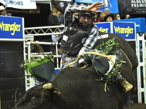 Jordan Hansen from Calgary scores 85.50 to win the bull riding champion during the Canadian Finals Rodeo at Northlands Coliseum in Edmonton, Sunday, November 13, 2016. Ed Kaiser/Postmedia (Edmonton Journal story by Jason) Photos off CFR for Jason Hills story in Monday, Nov. 14 publications.