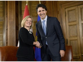 Premier Rachel Notley, left, and Prime Minister Justin Trudeau shake hands during a meeting on Parliament Hill on Nov. 29, 2016 in Ottawa.