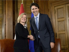 Prime Minister Justin Trudeau and Alberta Premier Rachel Notley shake hands during a meeting on Parliament Hill, Tuesday, Nov. 29, 2016 in Ottawa.