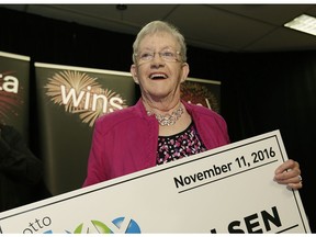 Lois Olsen, a retiree from Irma, Alta., picked up her cheque for $50 million in St. Albert on Wednesday, Nov. 30, 2016.