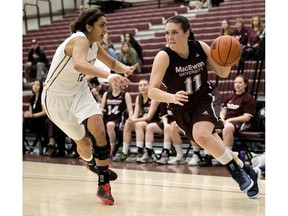 MacEwan University Griffins' Paige Knull (11) battles the University of Victoria Vikes' Marissa Dheensaw (11) during second half Canada West basketball action at MacEwan University, in Edmonton Alta. on Saturday March 5, 2016.