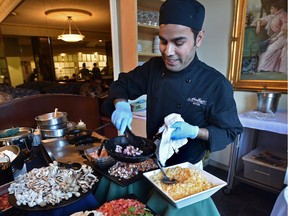 Making omelettes at the buffet brunch in the Royal Coach Dining Room at the Chateau Louis Hotel.