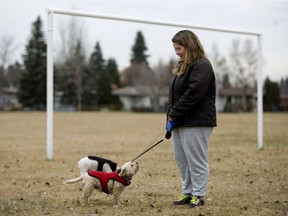 Hlif Thrainsdottir walks her dogs on Nov. 12, 2016, in one of 14 locations identified for a possible future dry pond.