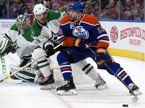 Edmonton Oilers forward Patrick Maroon, right, battles Dallas Stars defenceman Stephen Johns during NHL action at Rogers Place in Edmonton on Nov. 10, 2016.