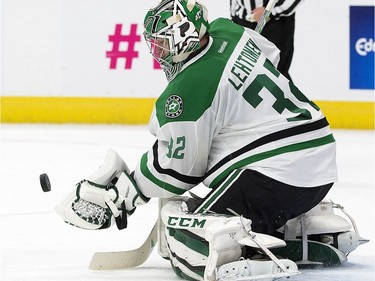 The Dallas Stars' goalie Kari Lehtonen (32) makes a save against the Edmonton Oilers during second period NHL action at Rogers Place, in Edmonton on Friday Nov. 10, 2016.