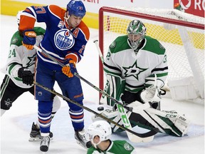 The Edmonton Oilers' Milan Lucic (27) tries to deflect a shot past the Dallas Stars' goalie Kari Lehtonen (32) during first period NHL action at Rogers Place, in Edmonton on Friday Nov. 10, 2016.  Photo by David Bloom Photos off Oilers game for multiple writers copy in Nov. 12 editions.