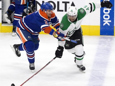 The Edmonton Oilers' Andrej Sekera (2) battles the Dallas Stars' Gemel Smith (46) during first period NHL action at Rogers Place, in Edmonton on Friday Nov. 10, 2016.