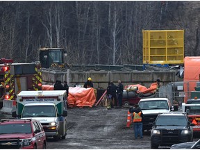 Police and fire personnel  respond to a worker's death underground at a sewer construction site on Ellerslie Road near 142 Street in Edmonton on Nov. 1, 2016. This is one incident that has prompted the city to review its safety protocol for employees.