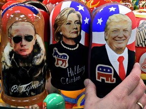 Traditional Russian wooden nesting dolls, Matryoshka dolls, depicting Russia's President Vladimir Putin, U.S. Democratic presidential nominee Hillary Clinton and U.S. president-elect Donald Trump were on sale at a gift shop in central Moscow on Nov. 8, 2016. Ukraine, Russia's neighbour, has reason to be wary of Trump's evolving relationship with Putin, writes David Marples.