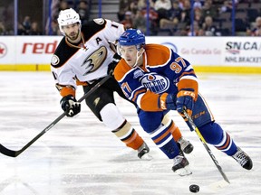 Anaheim Ducks' Ryan Kesler (17) chases Edmonton Oilers' Connor McDavid (97) during first period NHL action in Edmonton, Alta., on Monday March 28, 2016.