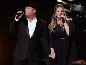 Garth Brooks and Trisha Yearwood perform onstage at the 50th annual CMA Awards in November — they're coming here Feb. 18.