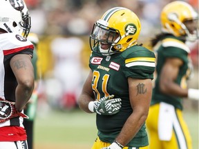 Edmonton's Calvin McCarty (31) chats with Ottawa's David Hinds (20) during a CFL game between the Edmonton Eskimos and the Ottawa Redblacks at the Brick Field at Commonwealth Stadium in Edmonton on Saturday, June 25, 2016. Ian Kucerak / Postmedia