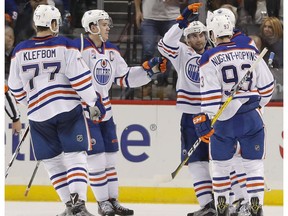 The Edmonton Oilers celebrate a goal scored by left wing Milan Lucic (27) against the New York Islanders during the second period of an NHL hockey game, Saturday, Nov. 5, 2016, in New York.