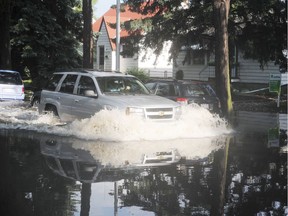 A Parkallen street near 63 Avenue and 111 Street is flooded after heavy overnight rain, July 14, 2012.