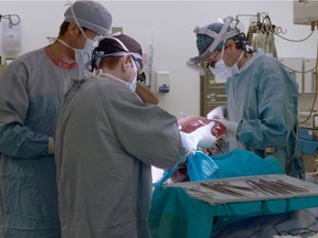 Surgeons removing organs at the U of A's Transplant Institute, seen in Memento Mori.