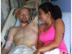 Bo Cooper, left, and his wife Irish Cooper, spend a few moments together in a hospital bed. Cooper died of Nov. 6, 2016.