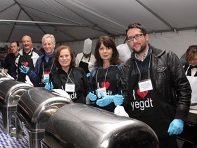 Ian O’Donnell (right) serves breakfast at an I Love YEG Downtown event in 2012.