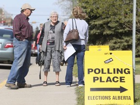 Voters cast their ballots in the Alberta provincial election at the Olds United Church in Olds on May 5, 2015.