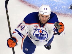 Edmonton Oilers right wing Zack Kassian, left, jumps for the puck during the second period of an NHL hockey game against the Los Angeles Kings, Thursday, Nov. 17, 2016, in Los Angeles.