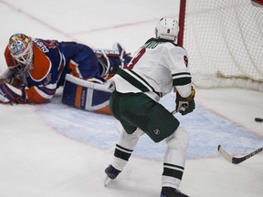 Edmonton Oilers Connor McDavid (97) is upended by Minnesota Wild's Jared Spurgeon (46) (not in picture) during second period NHL action on Sunday, December 4, 2016 in Edmonton.
