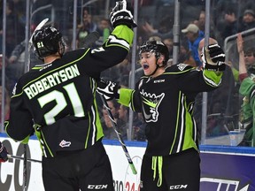Edmonton Oil Kings Nick Bowman, right, celebrates a goal with teammate Tyler Robertson against the Lethbridge Hurricanes at Rogers Place on Friday, December 16, 2016.