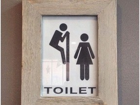 A controversial bathroom sign inside XO Bistro + Bar at 10238 103 St. in Edmonton was taken down on Monday, Dec. 12, 2016, after backlash over social media.