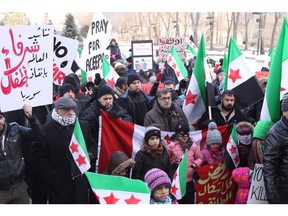 A few hundred people gathered in front of the Alberta Legislature on Dec. 17, 2016, to call on the Canadian government to offer more humanitarian support to civilians suffering from conflict in Syria.