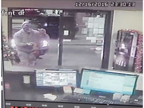 Blackfalds RCMP are looking for two masked suspects who stole an ATM machine from the Howard Johnson Motel on Gasoline Alley in Red Deer, Alta. on Friday, Dec. 16, 2016.