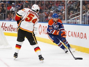 Taylor Beck of the Edmonton Oilers skates against the Calgary Flames' Rasmus Andersson during a preseason game at Rogers Place on Sept. 26, 2016. (Codie McLachlan)