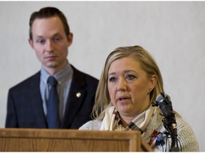 St. Albert-Edmonton Conservative MP Michael Cooper, left, joins Shelly MacInnis-Wynn, the widow of Const. David Wynn, at a news conference on Friday, Dec. 9, 2016  in St. Albert, where she voiced her support for Bill S-217, known as Wynn's Law.