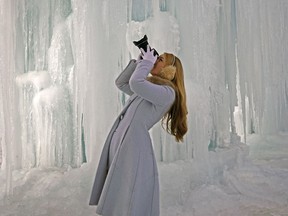 Corrine Thiessen photographs the ice castle at Hawrelak Park in Edmonton on Dec. 22, 2016.