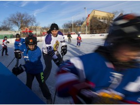 Const. Jason Ror takes part in the eighth annual McCauley Cup as downtown police officers lace up their skates for a friendly game of hockey at the McCauley ice rink on Tuesday, Dec. 27, 2016, in Edmonton.