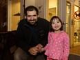 Dustin Lafleur, left, and Karamia Yee pose during Smudge's  birthday party at the Edmonton Humane Society.